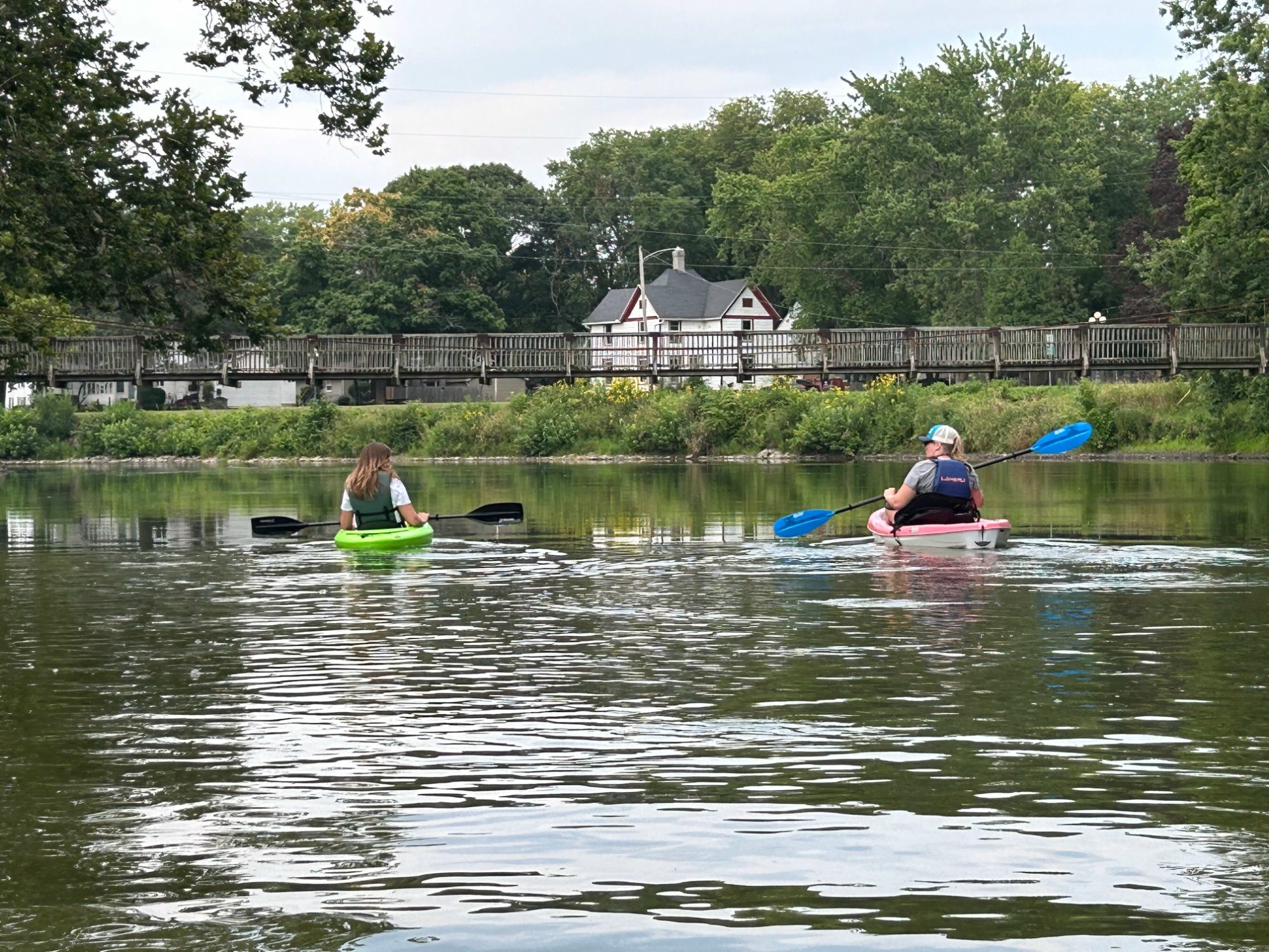 Kayakers on a float trip on the Vermilion River near Pontiac, Illinois